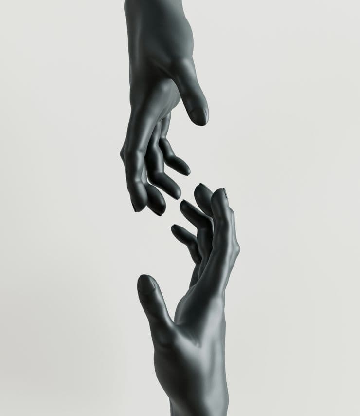 Two hands reaching for each other